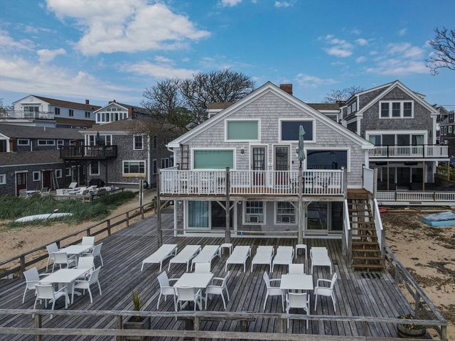an outdoor space with furniture and umbrella