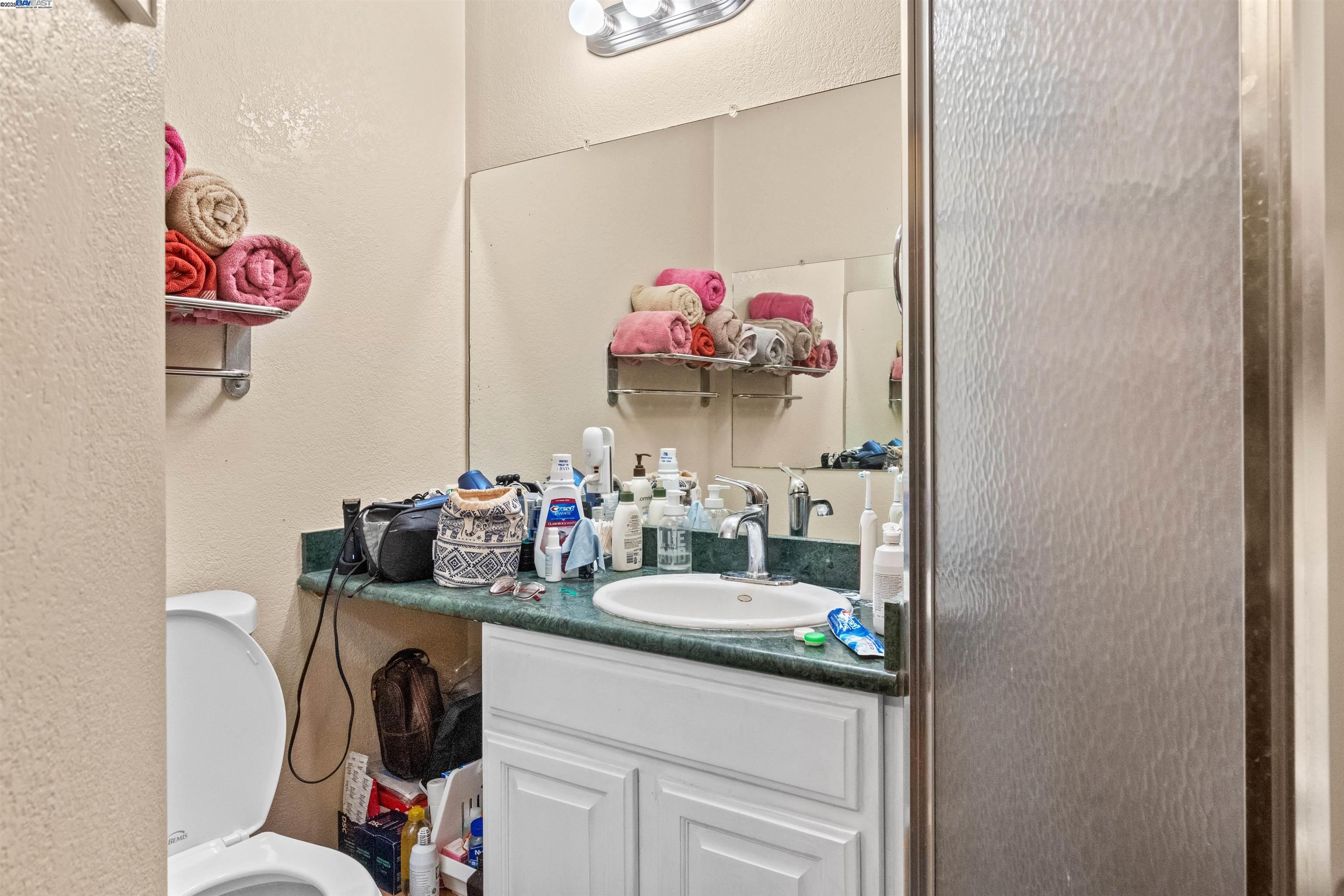 1523 Lincoln Avenue Alameda, CA 94501 - Photo 18 of 32 a bathroom with a sink and a mirror