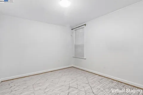 a bedroom with a bed and a large mirror