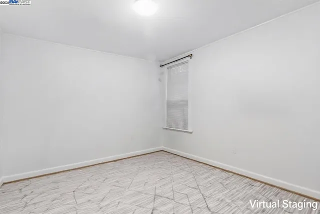 a bedroom with a bed and a large mirror