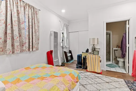 a view of a backyard with a patio and wooden fence
