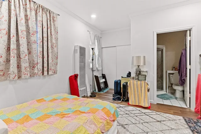 a view of a backyard with a patio and wooden fence