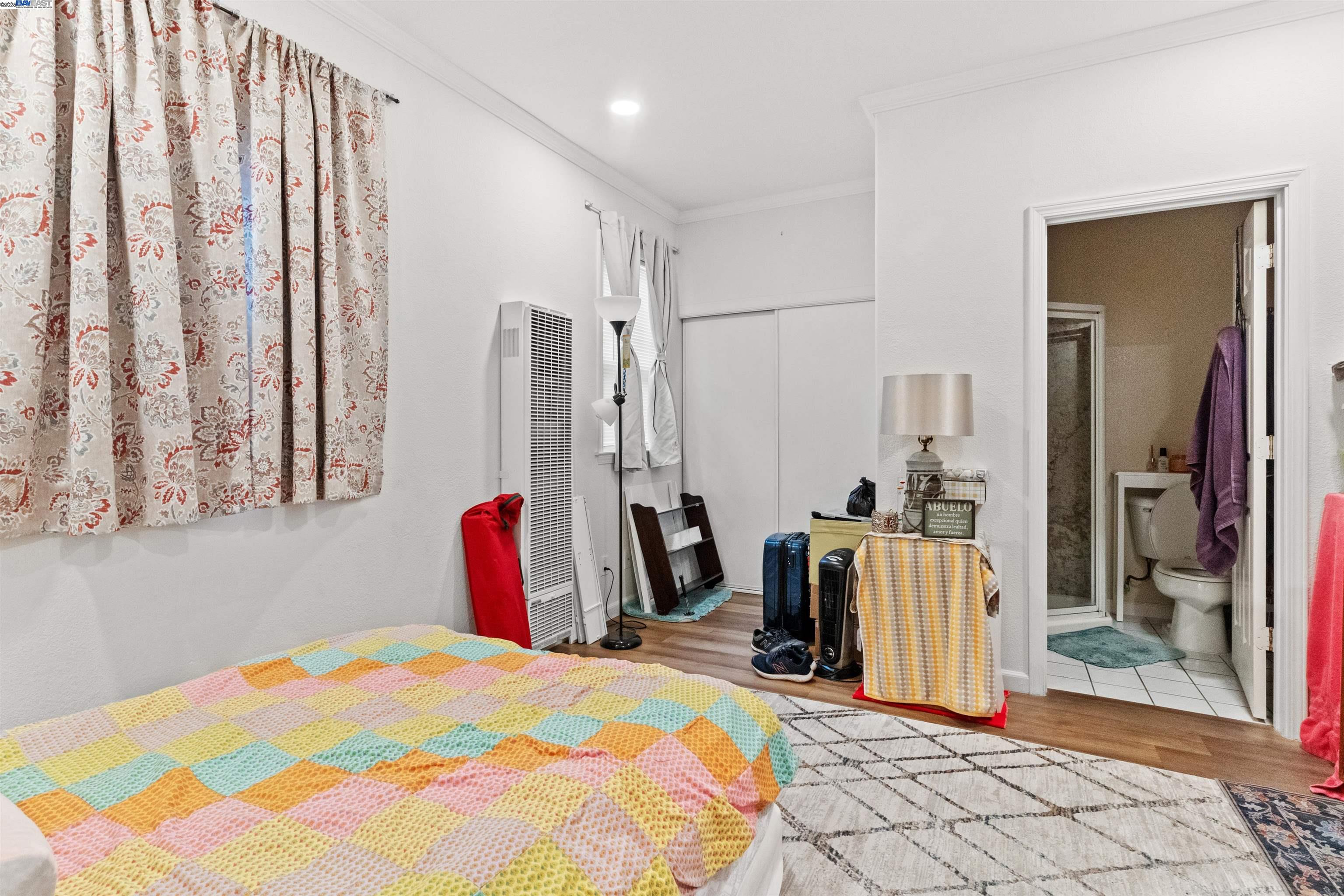 1523 Lincoln Avenue Alameda, CA 94501 - Photo 21 of 32 a bedroom with a bed and a large mirror