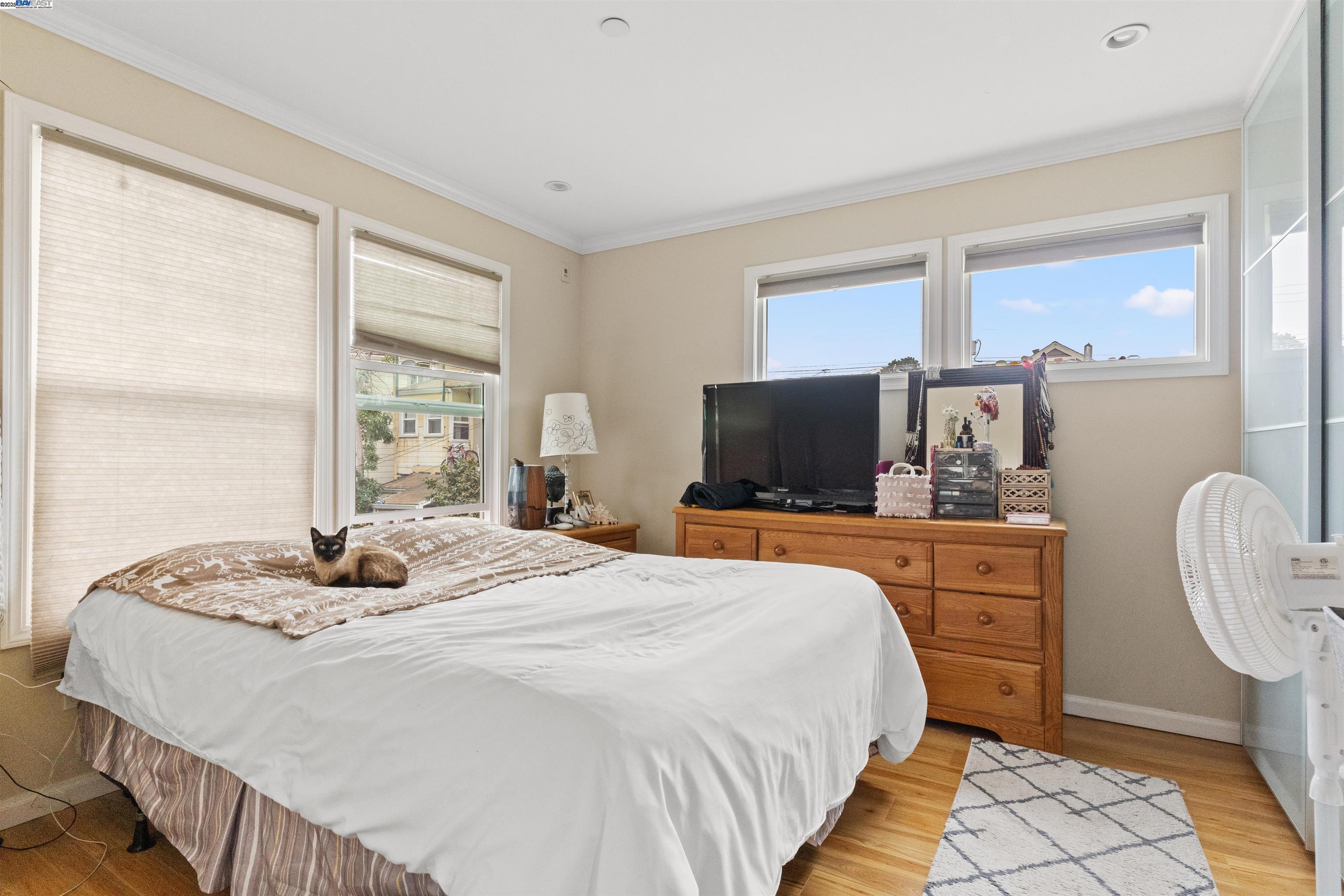 1523 Lincoln Avenue Alameda, CA 94501 - Photo 9 of 32 a bedroom with a bed and a flat screen tv