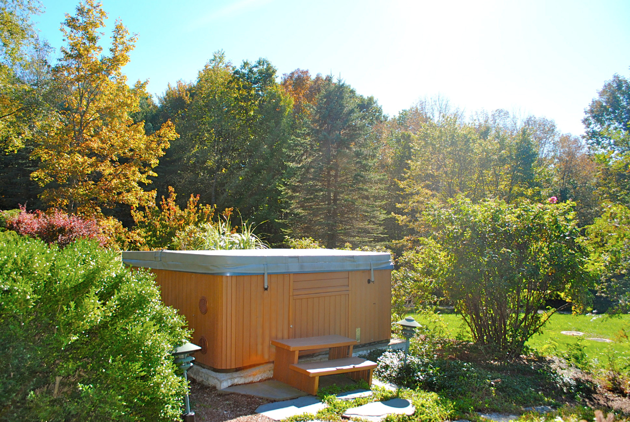 29 Corashire Road Monterey, MA 01245 - Photo 15 of 32 a view of a backyard with plants and a garden