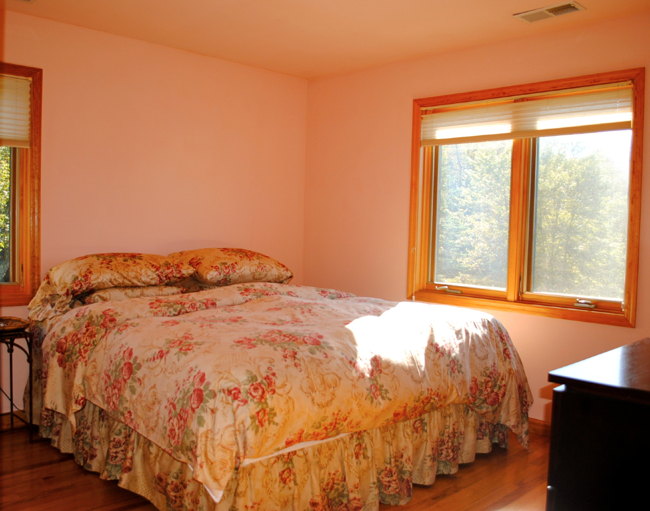 29 Corashire Road Monterey, MA 01245 - Photo 20 of 32 a bed sitting in a bedroom next to a window