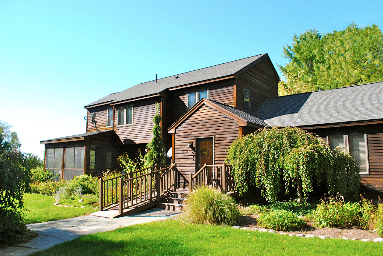 29 Corashire Road Monterey, MA 01245 - Photo 22 of 32 a front view of a house with a garden