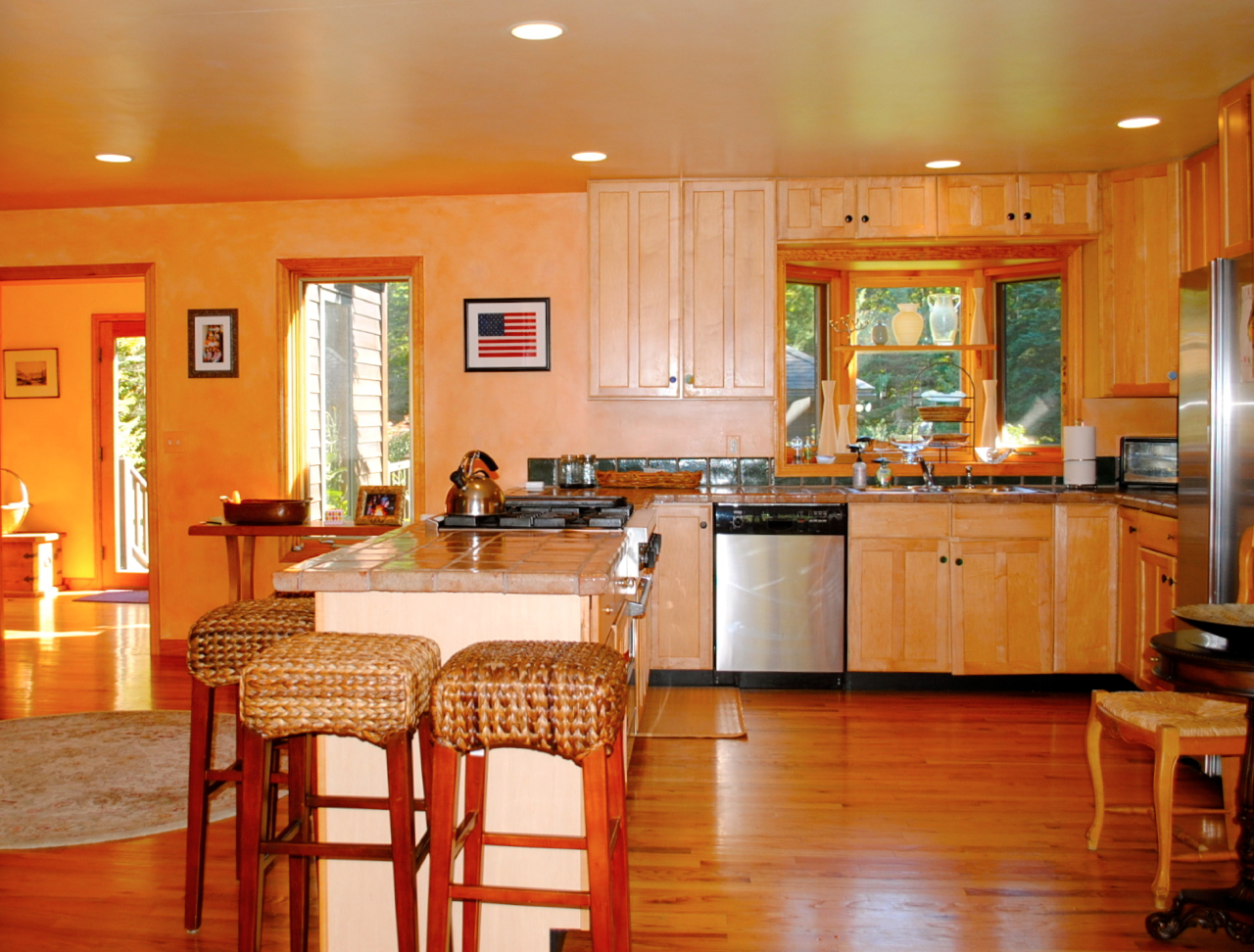 29 Corashire Road Monterey, MA 01245 - Photo 8 of 32 a kitchen with stainless steel appliances granite countertop wooden floor a stove a sink a dining table and chairs