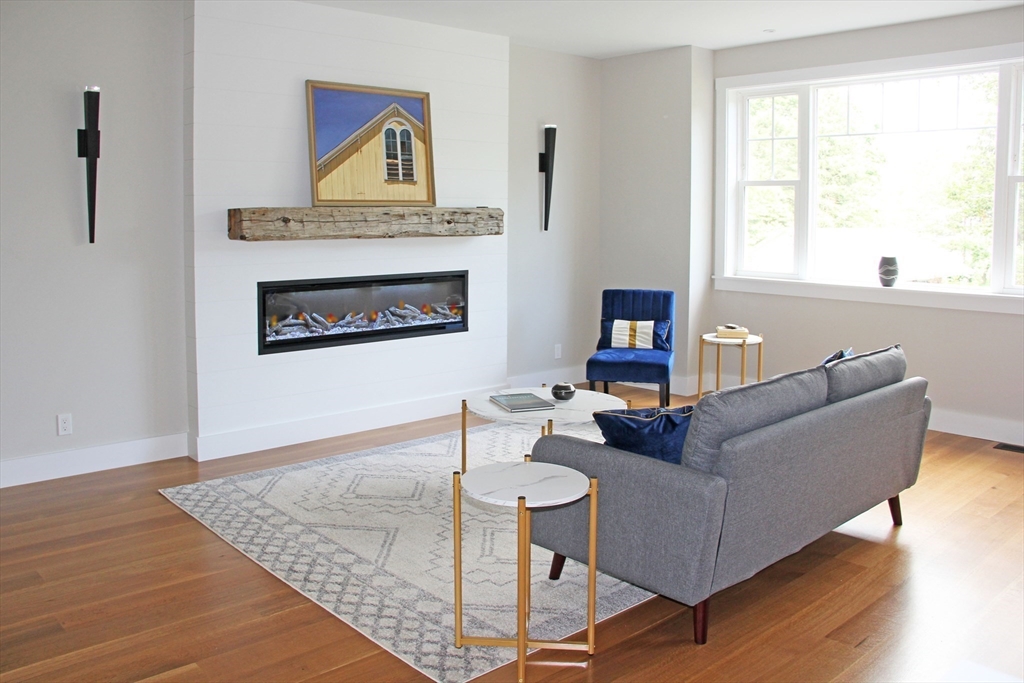 152-154 South Main Street, Unit 4 Northampton, MA 01062 - Photo 7 of 19 a living room with furniture and a fireplace