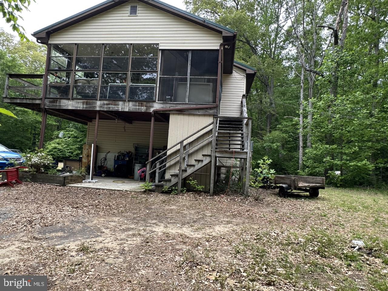 12723 Ridgely Road Greensboro, MD 21639 - Photo 20 of 43 Side view showing 3-season room and carport