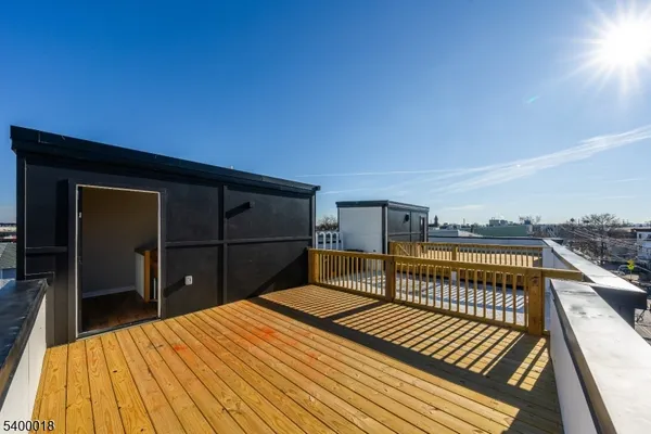 a view of balcony and wooden floor