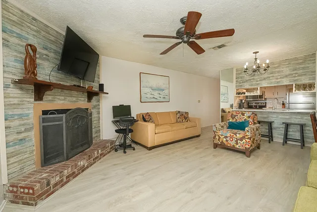 a living room with furniture and a fireplace