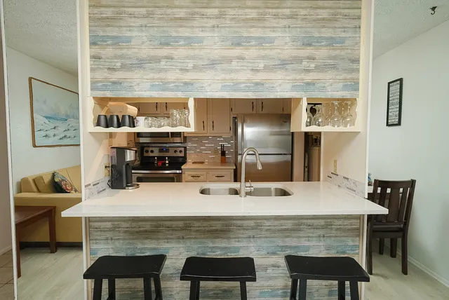 a dining table with chairs and natural light