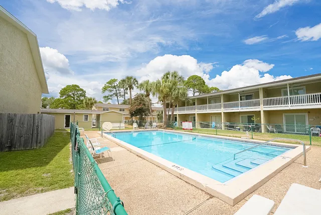 a view of a house with swimming pool
