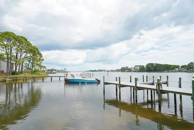a view of residential house with outdoor space and lake view