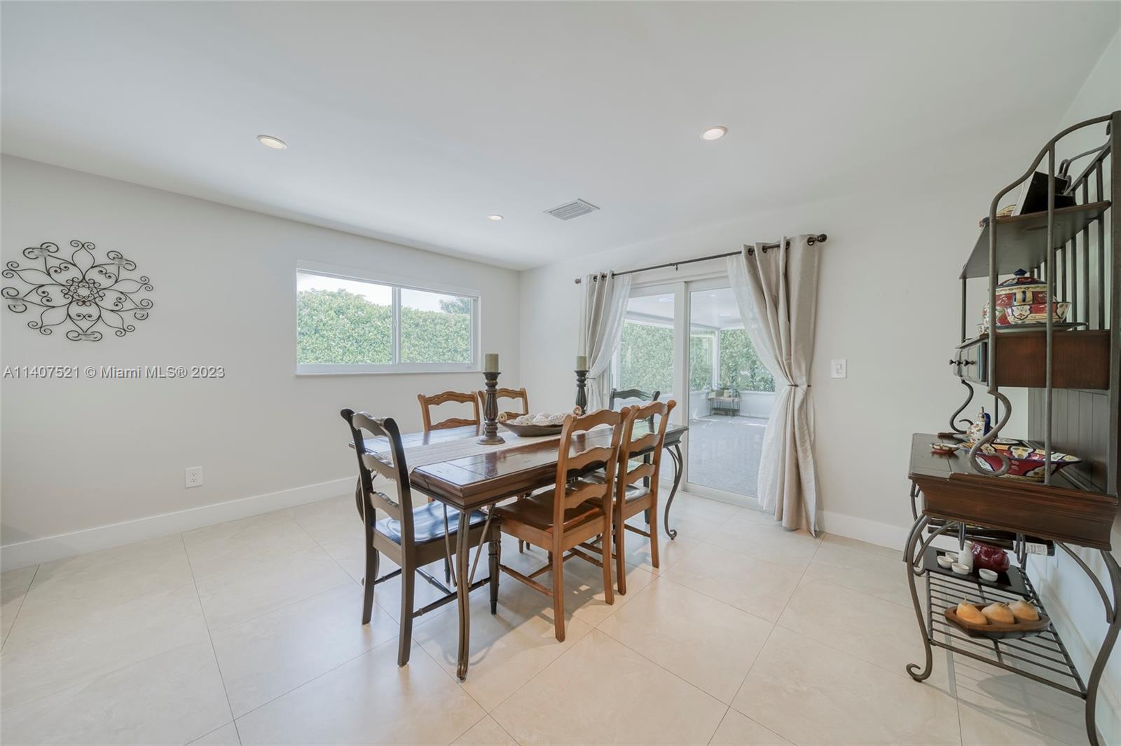 13401 Southwest 79th Street Miami, FL 33183 - Photo 13 of 34 a view of a dining room with furniture and window