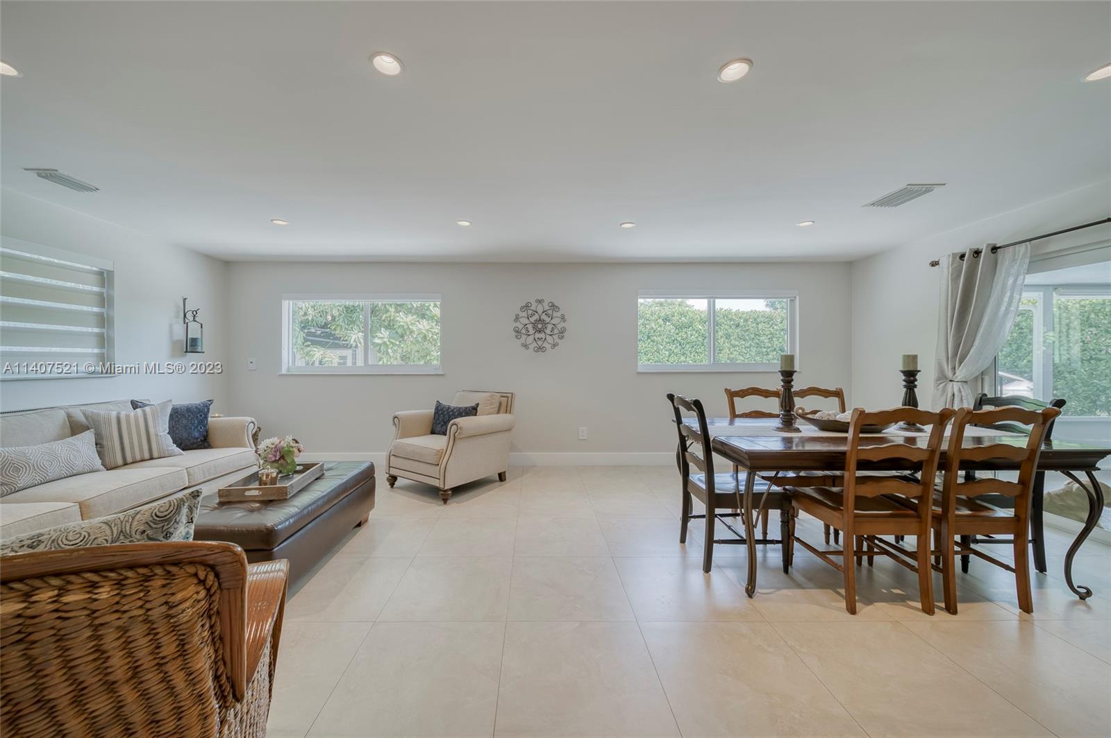 13401 Southwest 79th Street Miami, FL 33183 - Photo 14 of 34 a living room with furniture and a large window