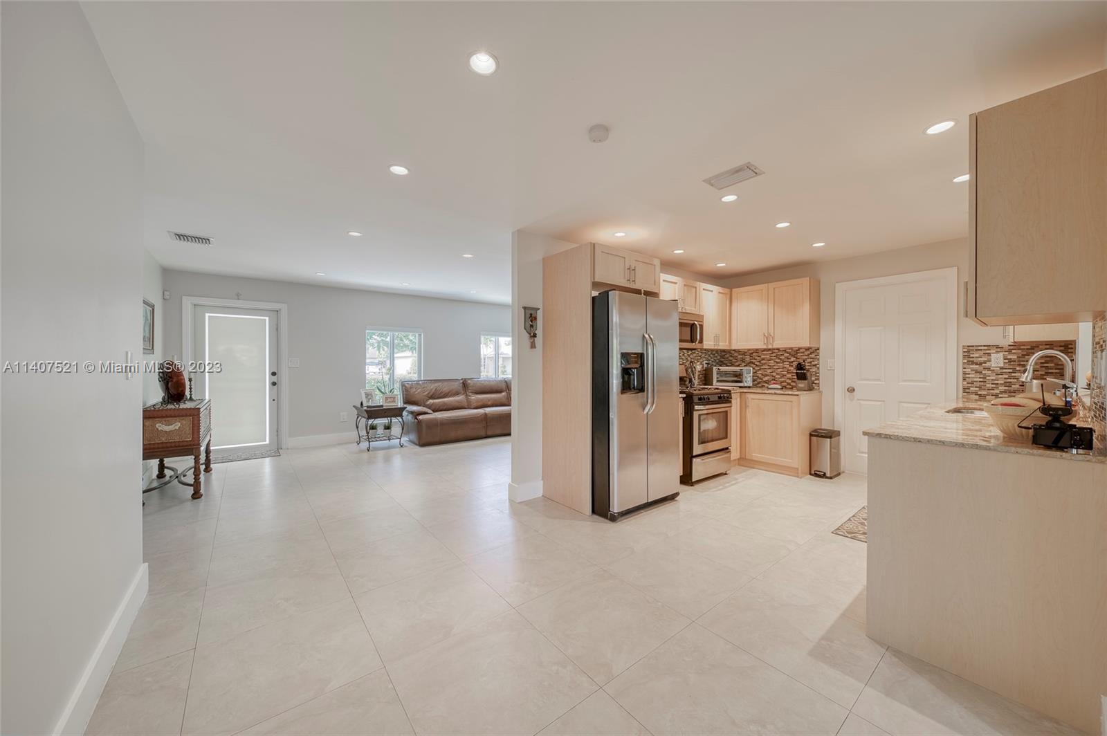 13401 Southwest 79th Street Miami, FL 33183 - Photo 15 of 34 a view of a kitchen with furniture and a refrigerator