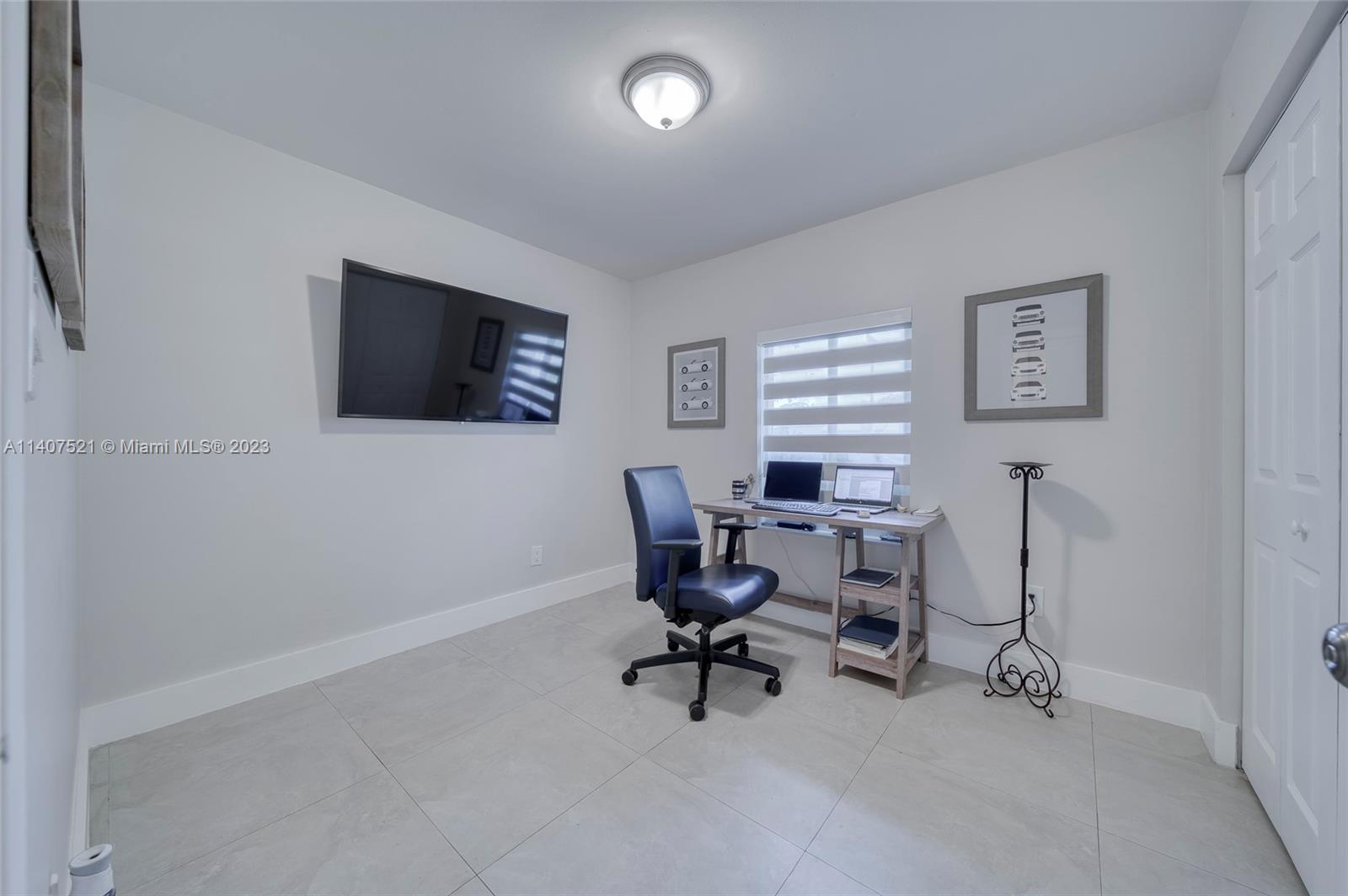 13401 Southwest 79th Street Miami, FL 33183 - Photo 16 of 34 a work room with furniture and a flat screen tv