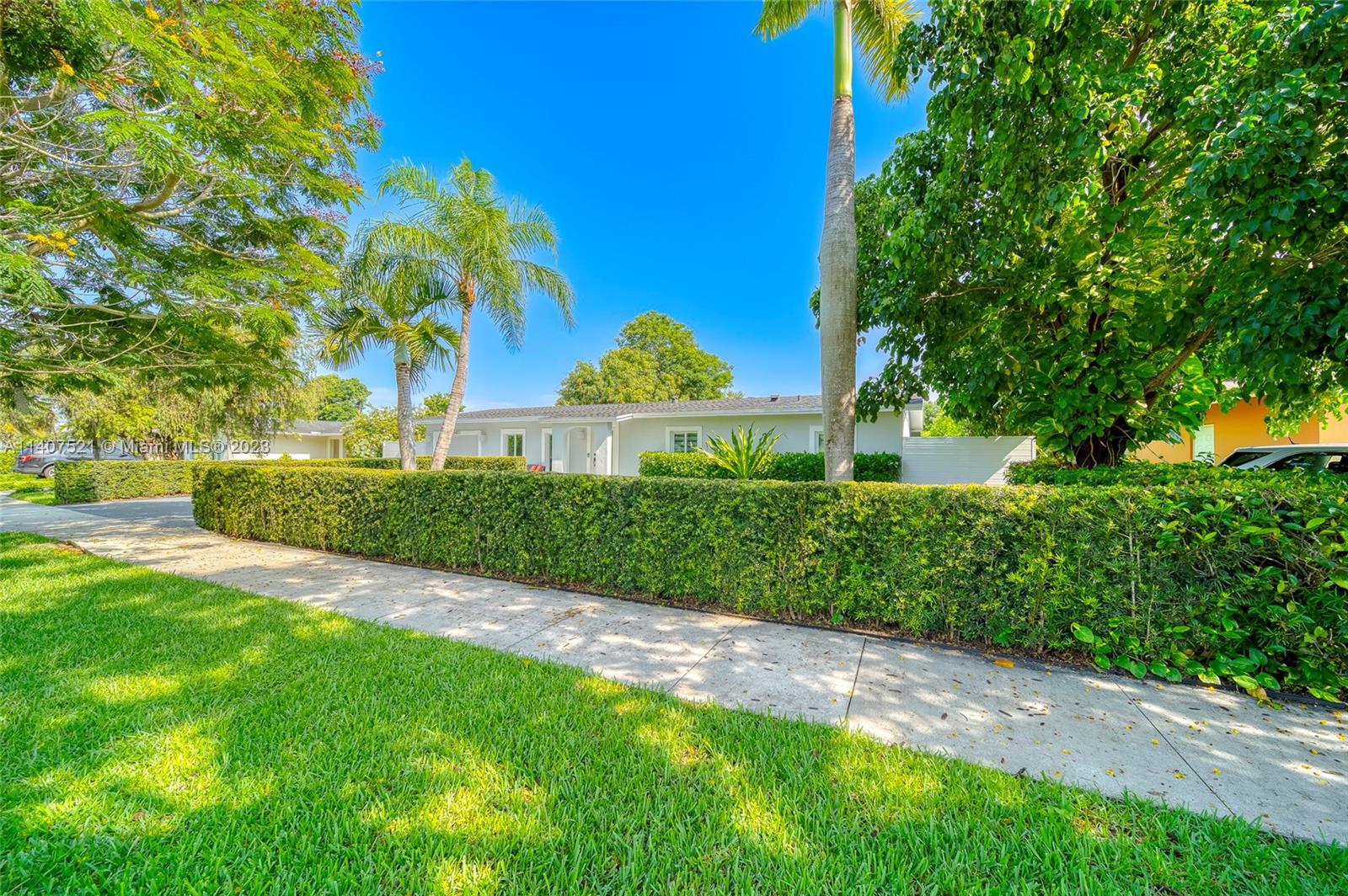 13401 Southwest 79th Street Miami, FL 33183 - Photo 2 of 34 a front view of a house with a yard