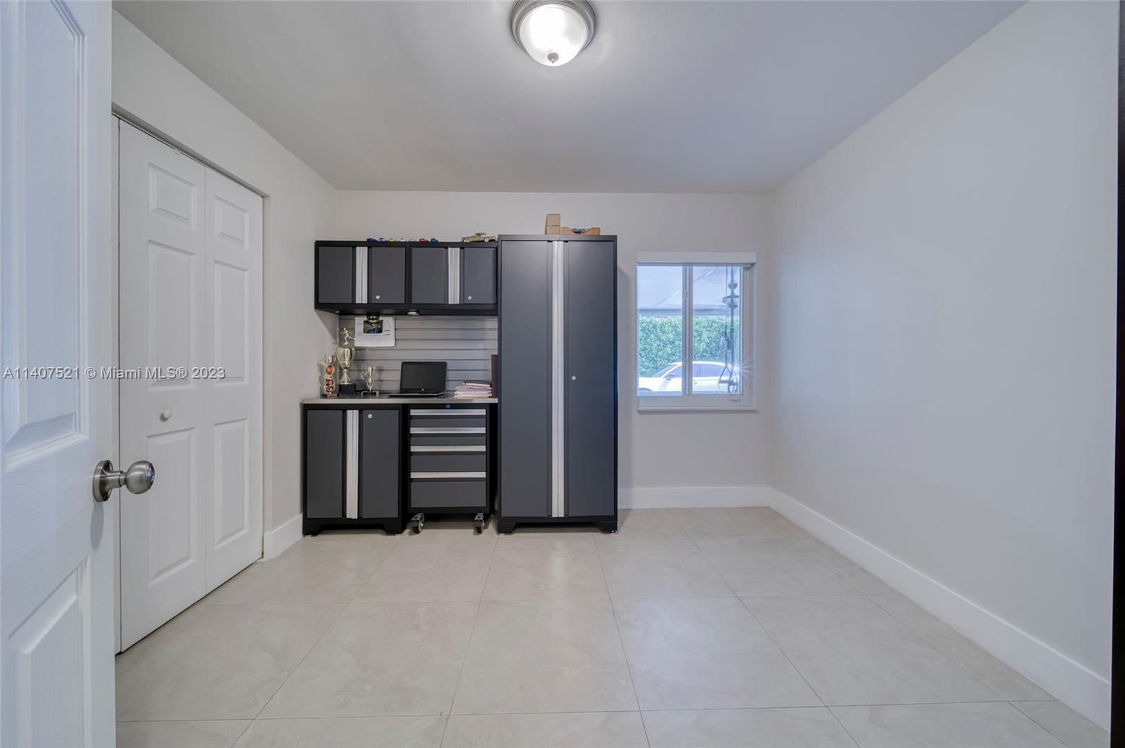 13401 Southwest 79th Street Miami, FL 33183 - Photo 23 of 34 a kitchen with stainless steel appliances a refrigerator and cabinets