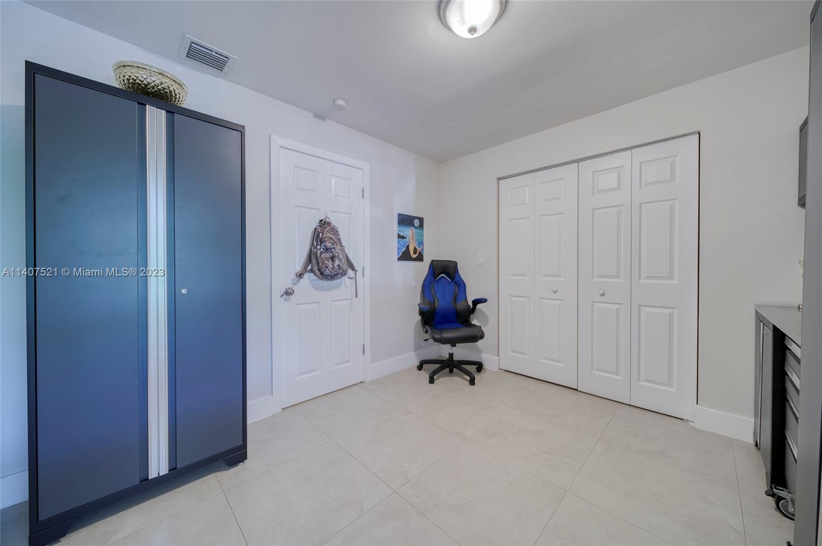 13401 Southwest 79th Street Miami, FL 33183 - Photo 24 of 34 a view of room with workspace and windows