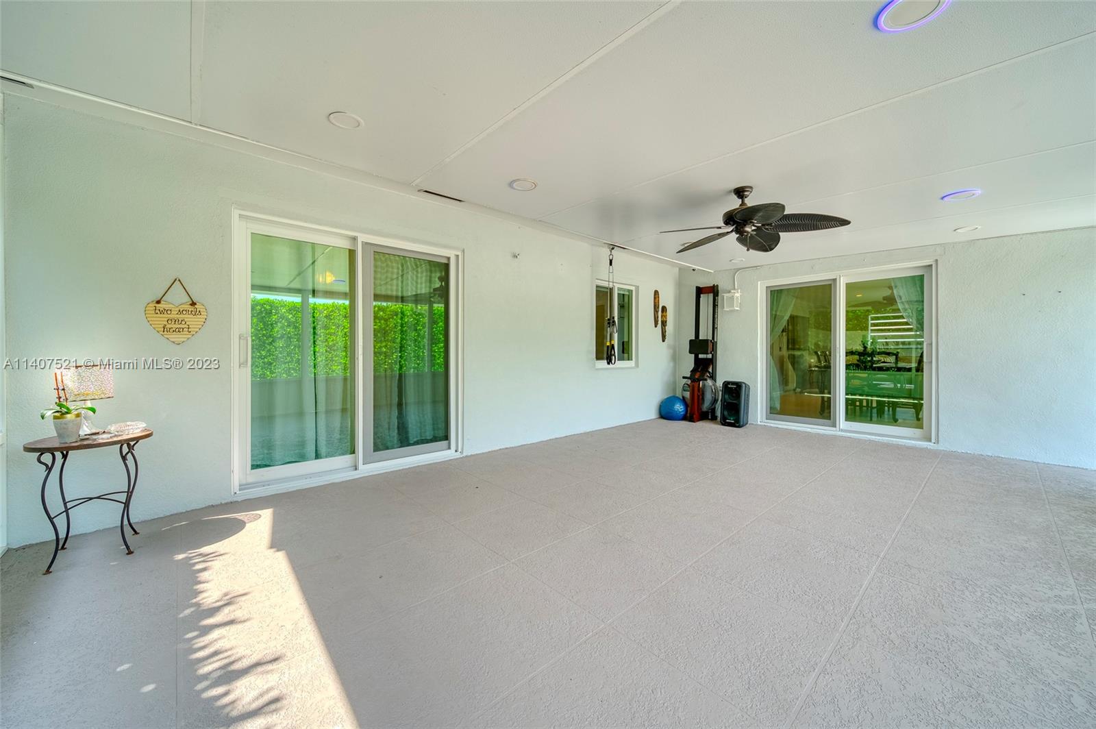 13401 Southwest 79th Street Miami, FL 33183 - Photo 30 of 34 a furnished livingroom with windows and chandelier