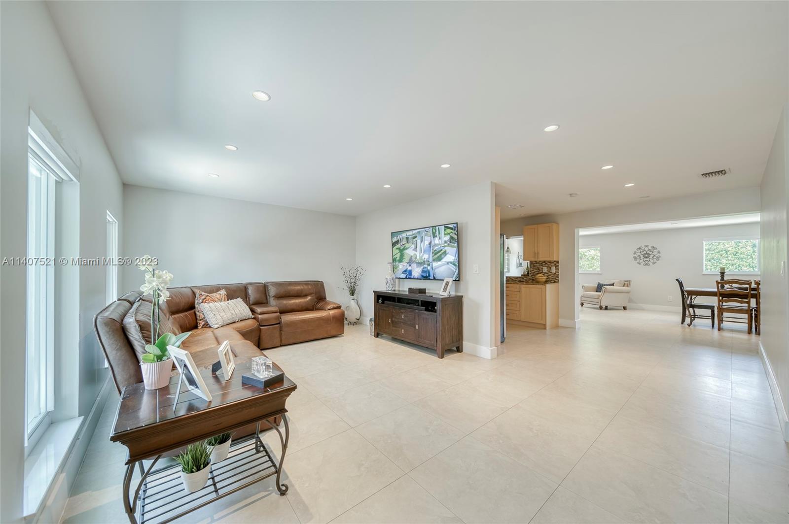13401 Southwest 79th Street Miami, FL 33183 - Photo 6 of 34 a living room with furniture and a table