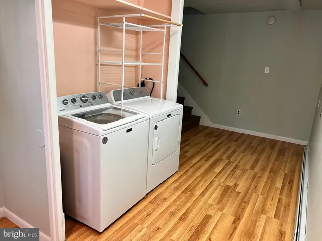a utility room with washer and dryer