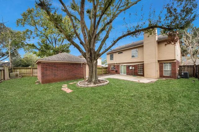 a view of a house with a back yard