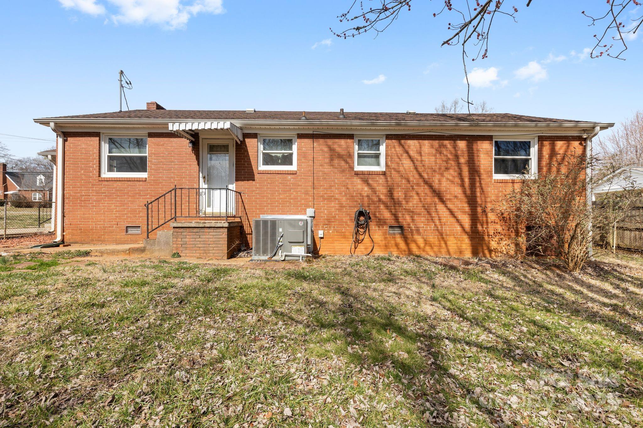 232 Hartness Road Statesville, NC 28677 - Photo 17 of 23 a front view of a house with a yard