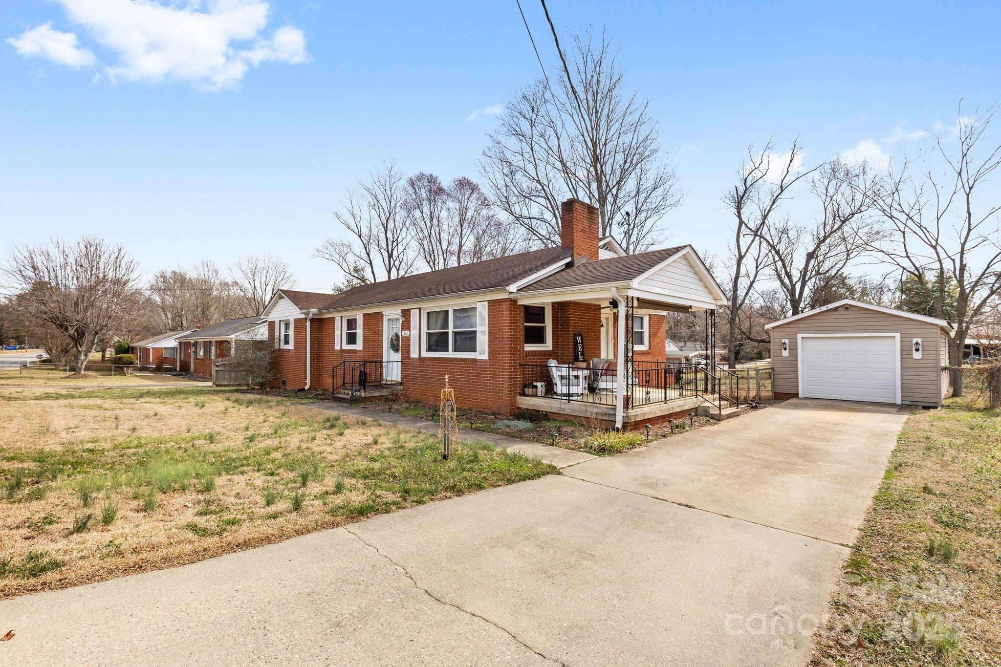 232 Hartness Road Statesville, NC 28677 - Photo 2 of 23 a front view of a house with a yard and garage