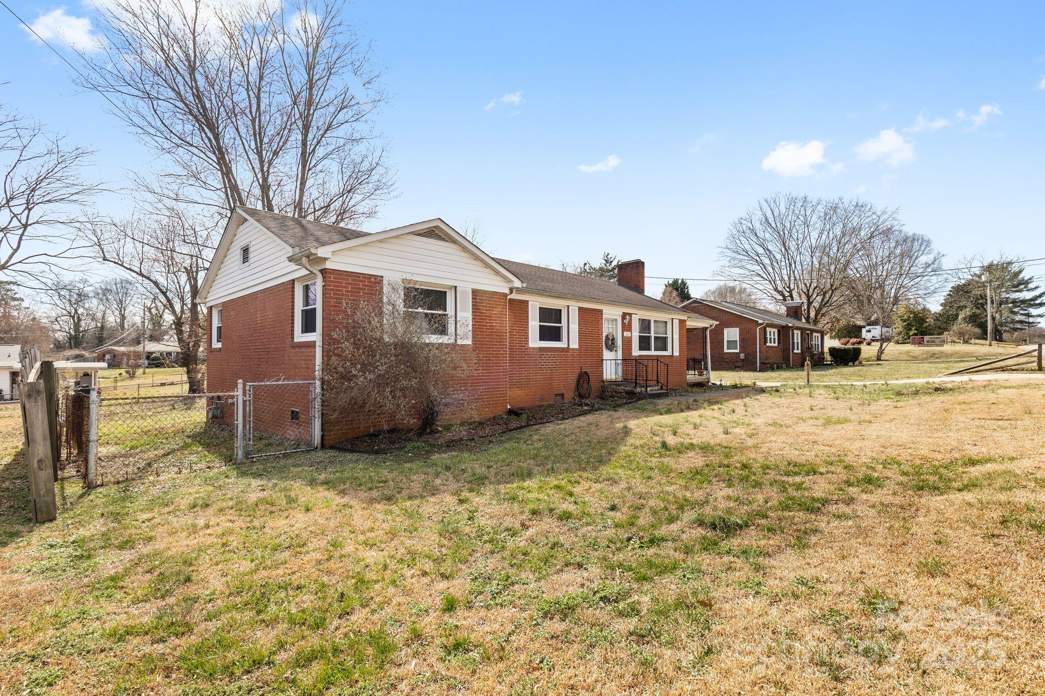 232 Hartness Road Statesville, NC 28677 - Photo 3 of 23 a view of a house with a yard covered in snow