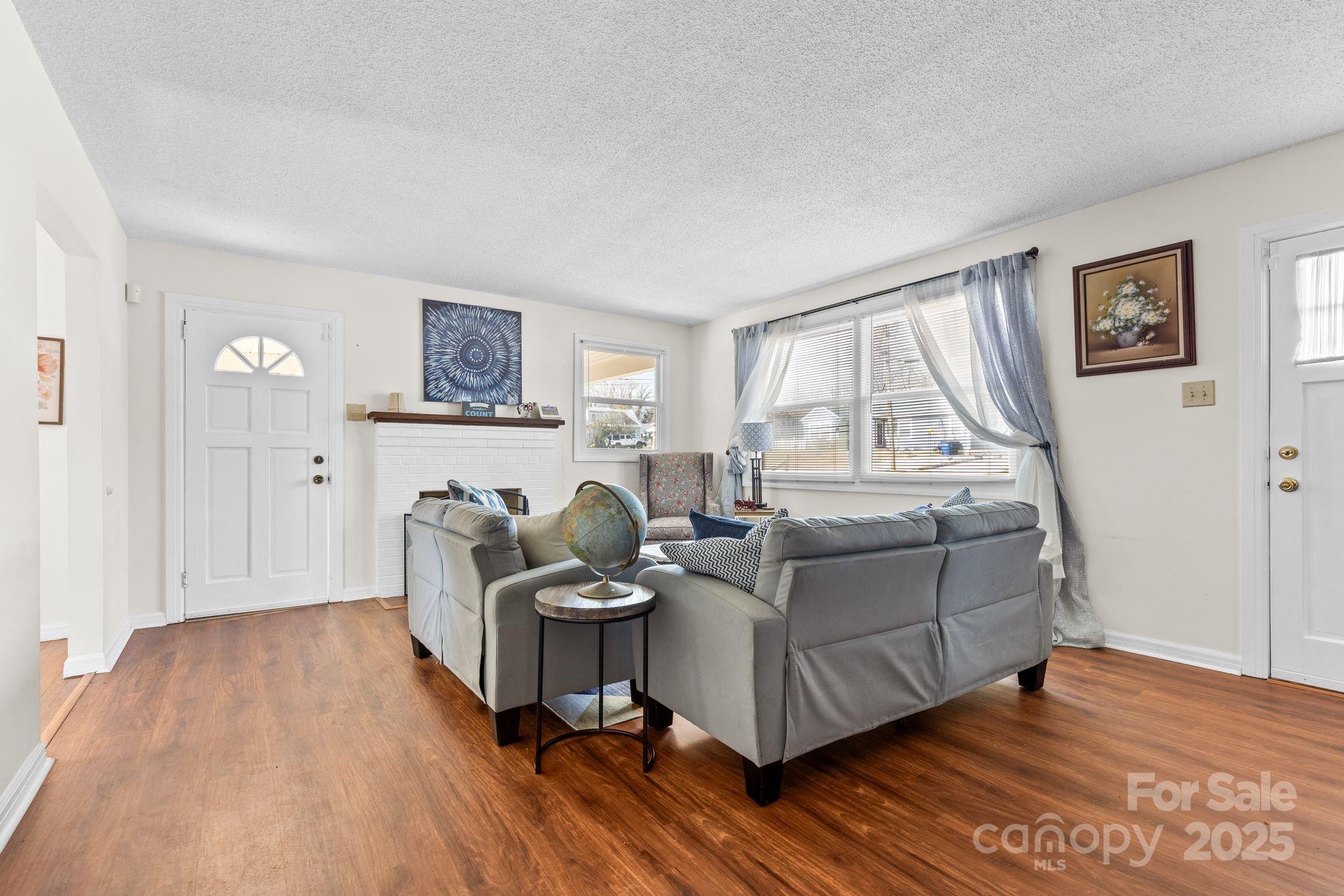 232 Hartness Road Statesville, NC 28677 - Photo 5 of 23 a living room with furniture and a wooden floor