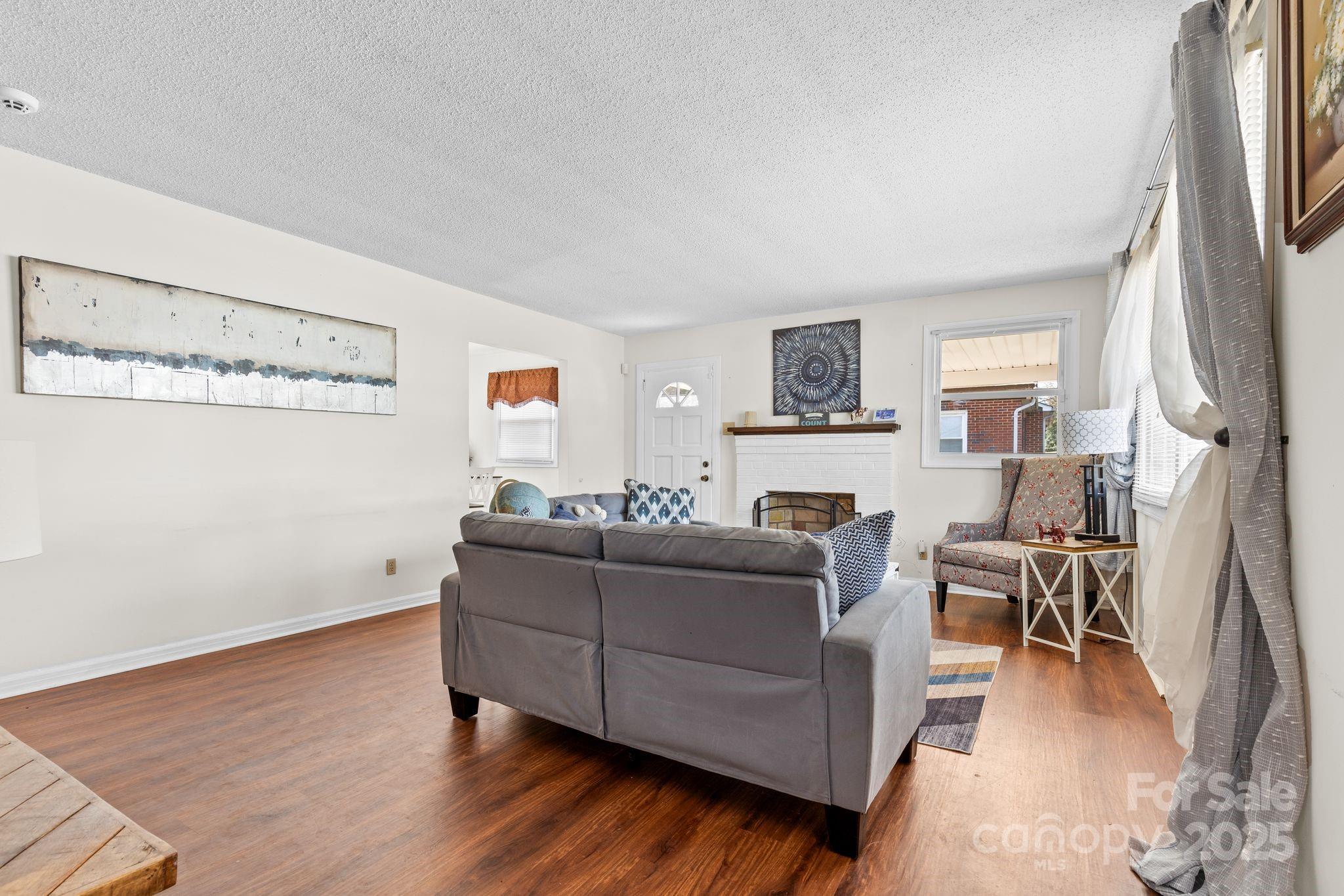 232 Hartness Road Statesville, NC 28677 - Photo 6 of 23 a living room with furniture and a flat screen tv