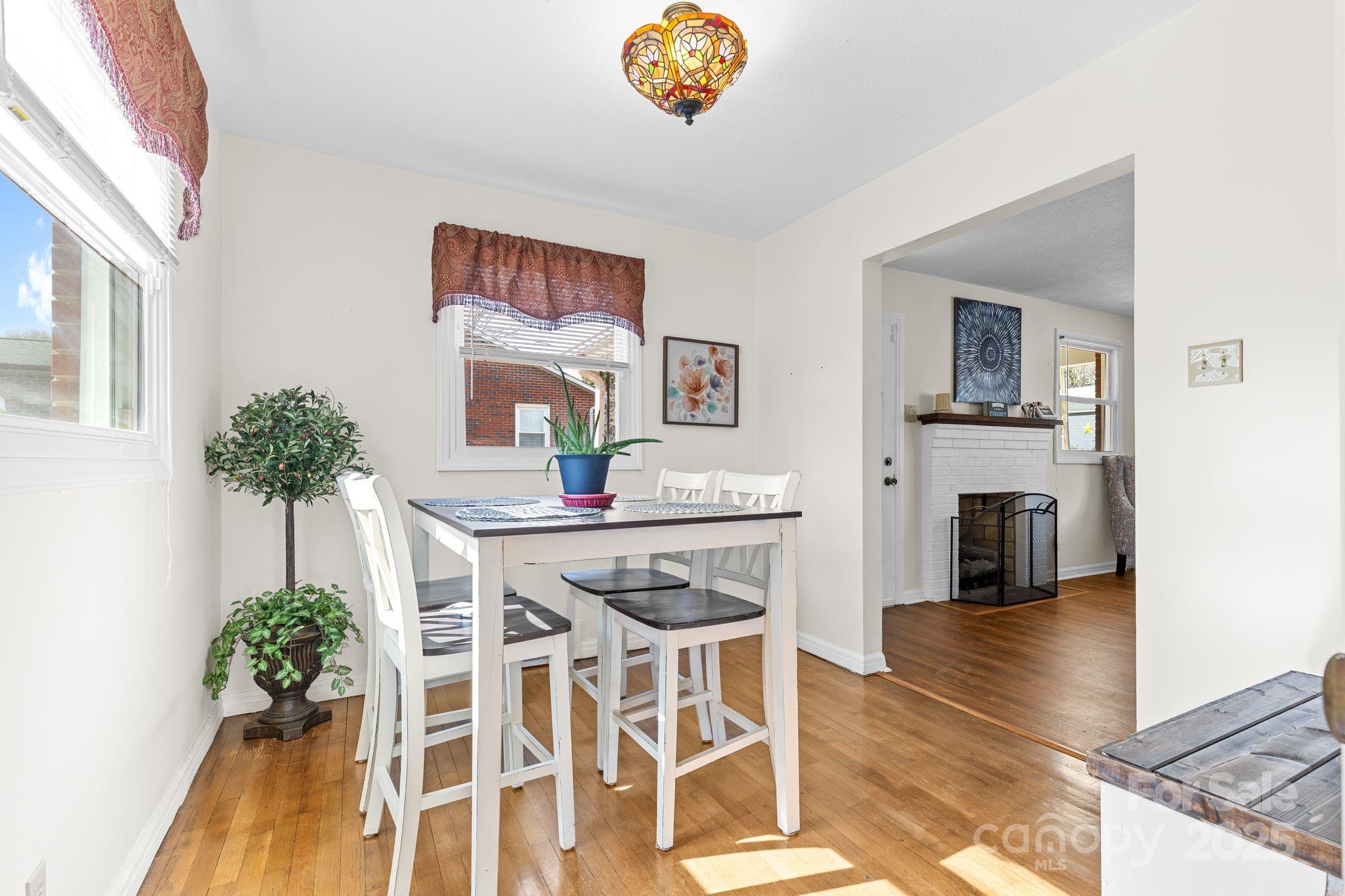 232 Hartness Road Statesville, NC 28677 - Photo 8 of 23 a kitchen with a table and chairs in it