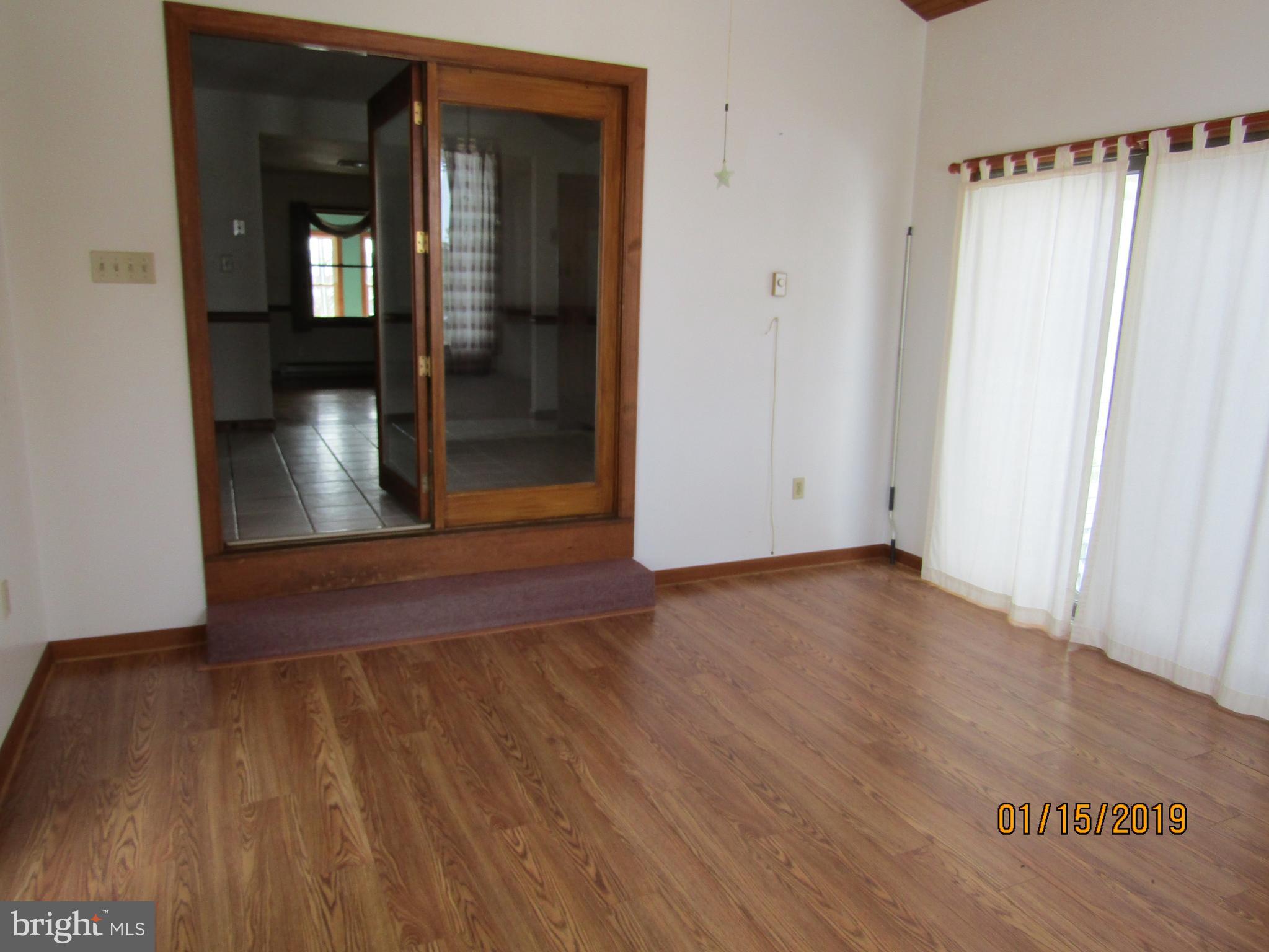 1295 Breneman Road Conestoga, PA 17516 - Photo 12 of 34 Sunroom looking into the kitchen