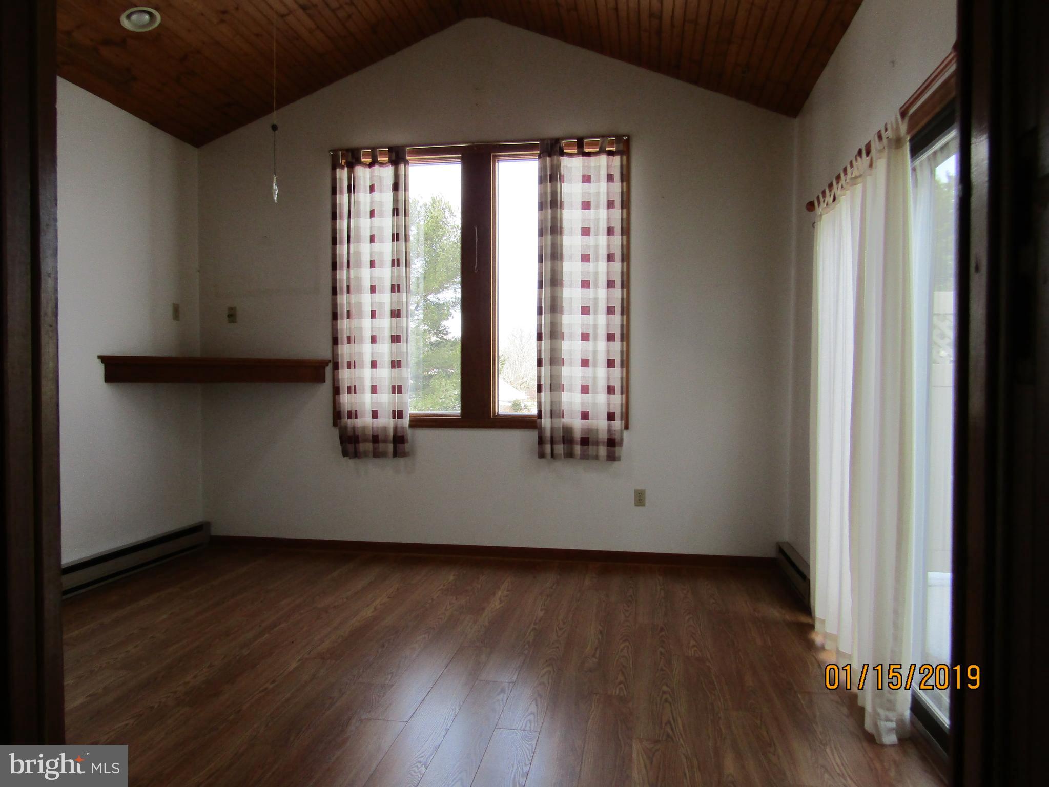 1295 Breneman Road Conestoga, PA 17516 - Photo 13 of 34 Sunroom with wood laminate floor