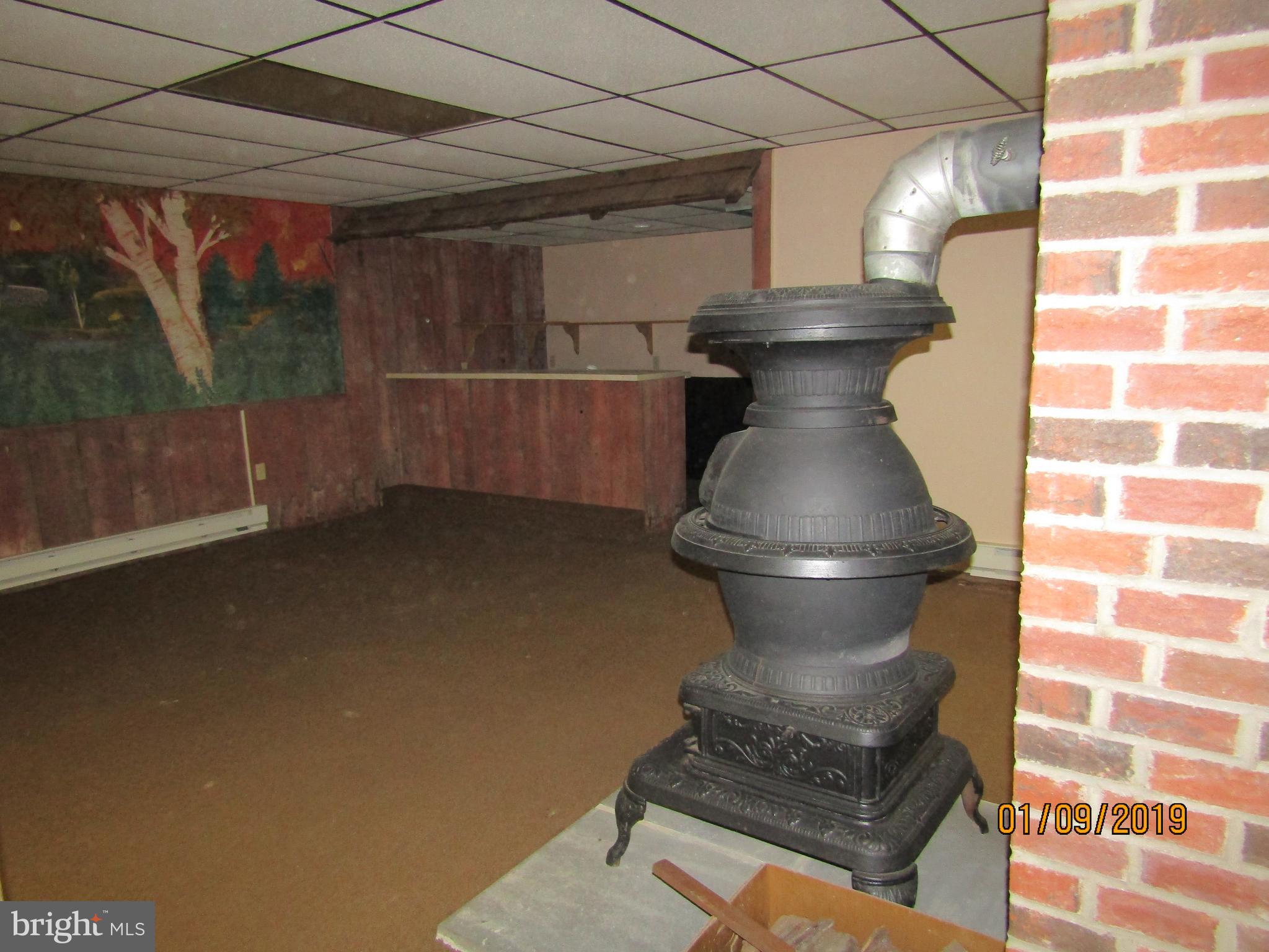 1295 Breneman Road Conestoga, PA 17516 - Photo 25 of 34 Cast iron fireplace for heat