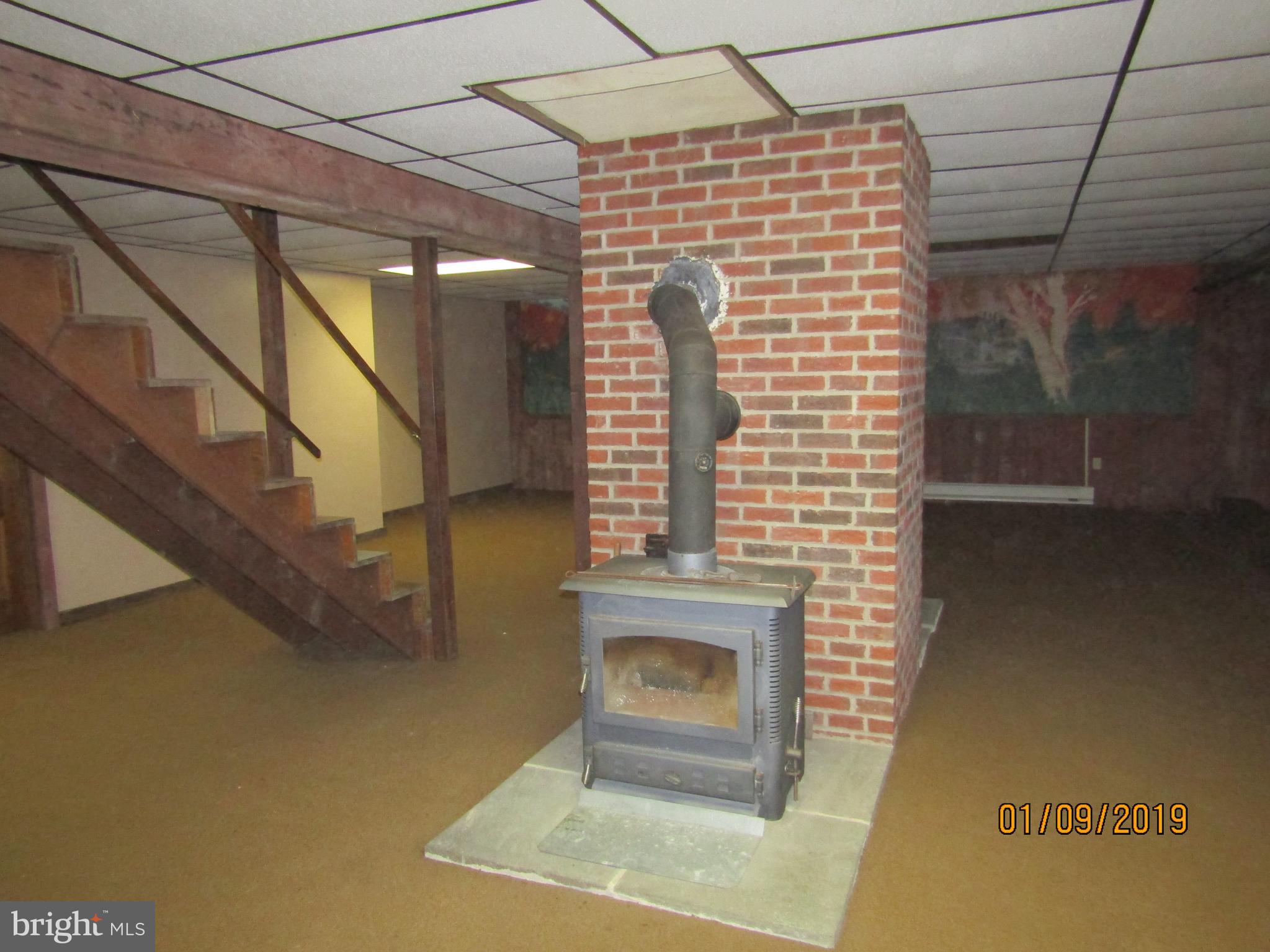 1295 Breneman Road Conestoga, PA 17516 - Photo 27 of 34 Fireplace in family in basement