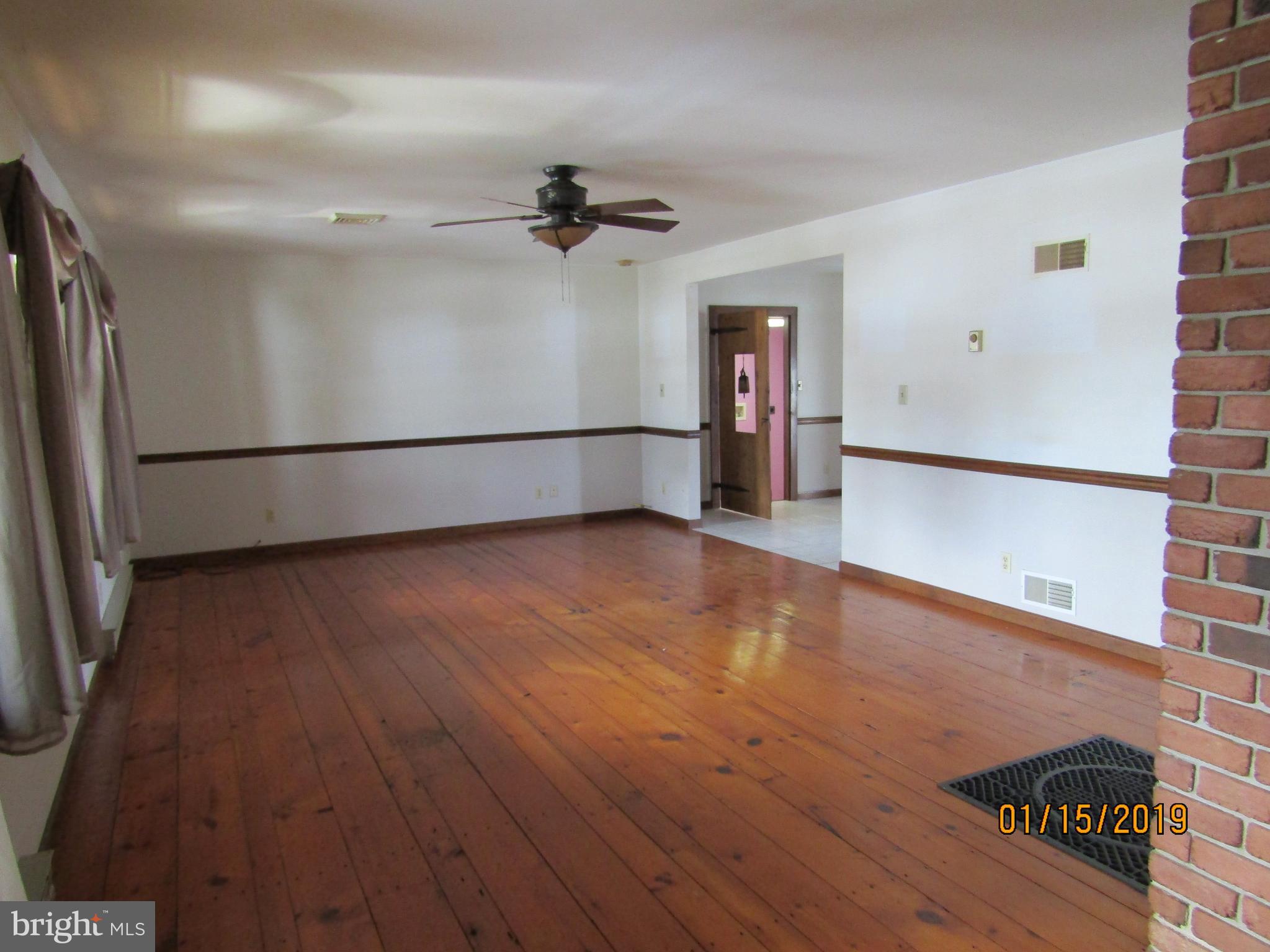 1295 Breneman Road Conestoga, PA 17516 - Photo 5 of 34 Living room opening to eat-in kitchen