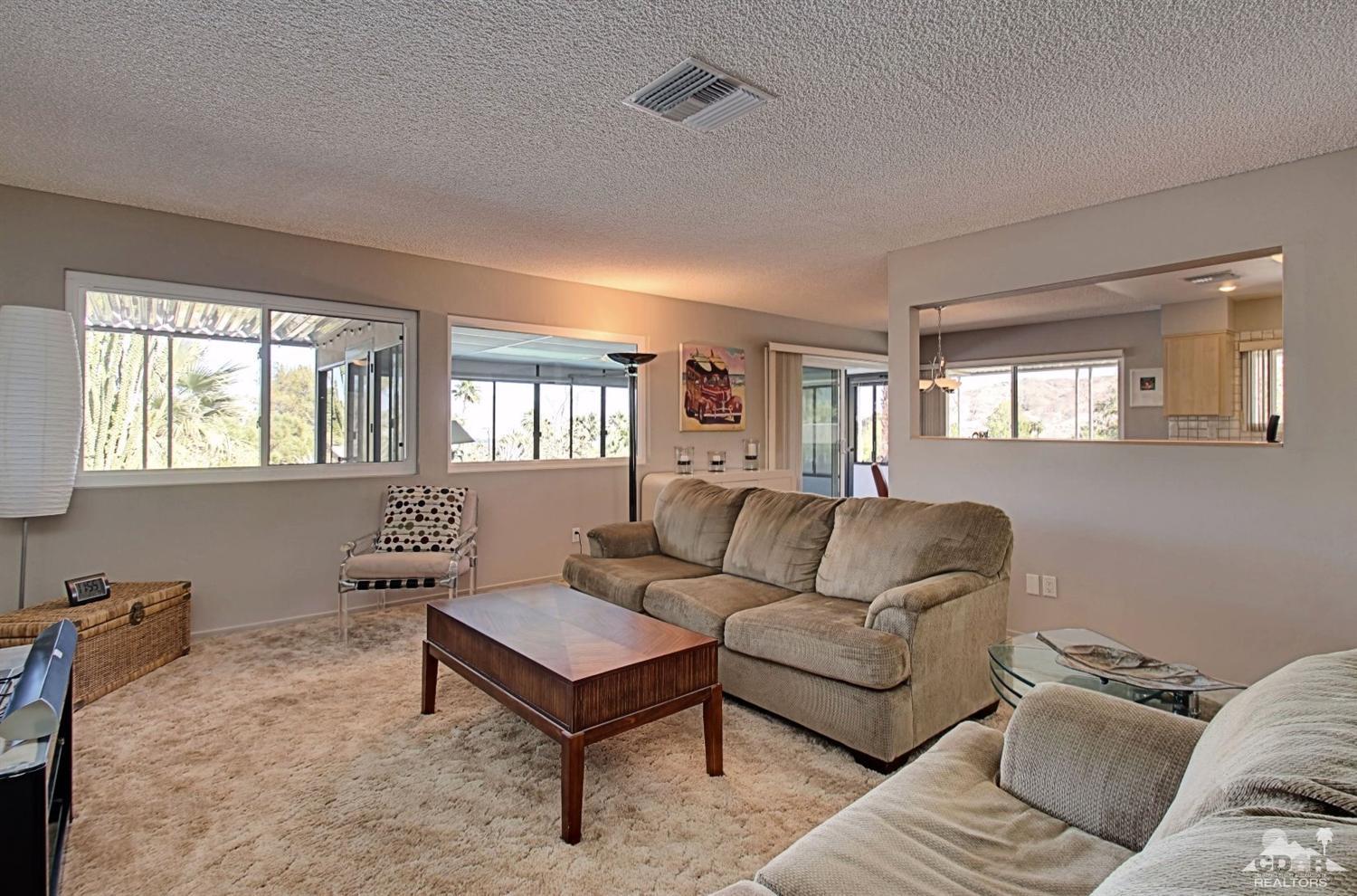 67860 Foothill Road Cathedral City, CA 92234 - Photo 19 of 30 a living room with furniture and a window