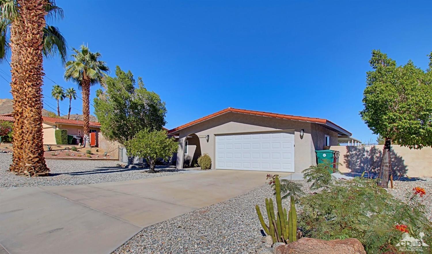 67860 Foothill Road Cathedral City, CA 92234 - Photo 3 of 30 a front view of a house with a garden