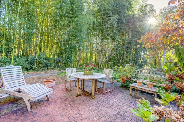 a backyard of a house with outdoor seating