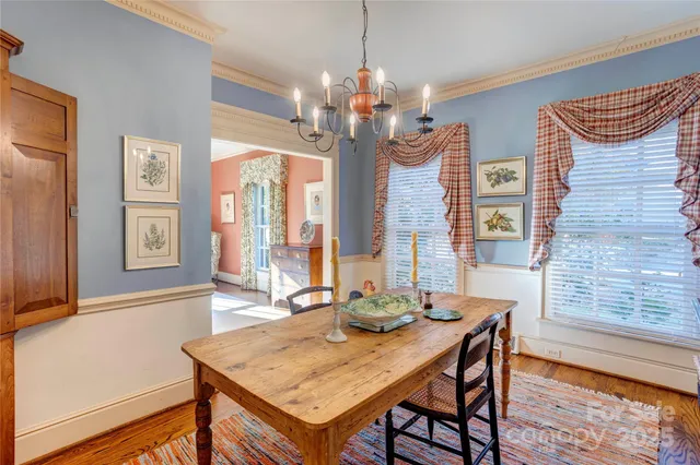 a view of a dining room with furniture and window