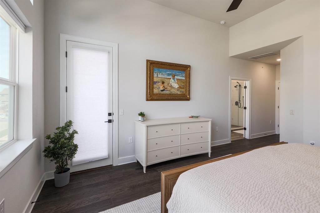 3907 Tilley Street Austin, TX 78723 - Photo 16 of 26 a bedroom with a bed and a potted plant