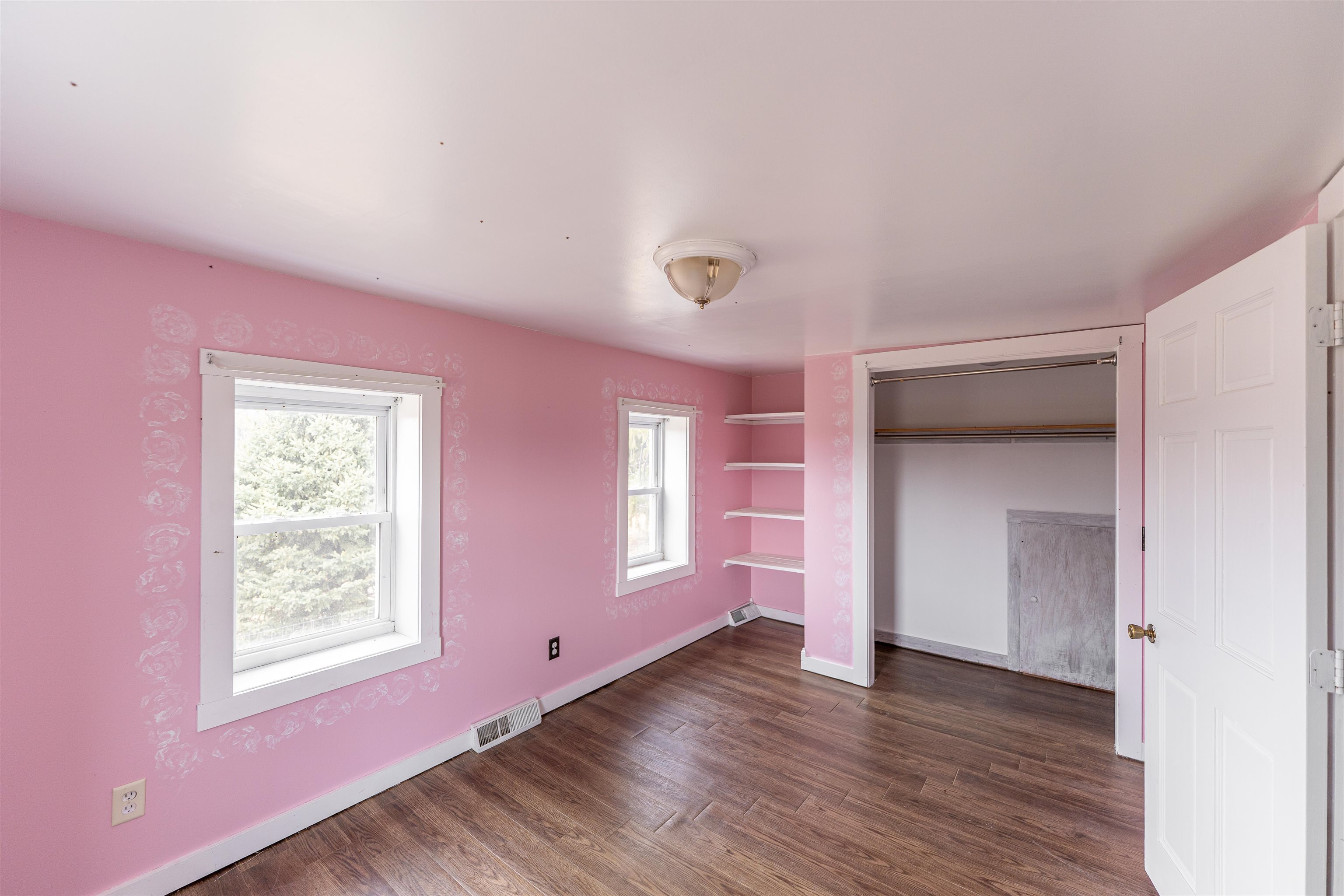 3651 North Brookville Road Forreston, IL 61030 - Photo 22 of 66 a view of an empty room with wooden floor and a window