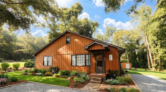 a front view of a house with garden