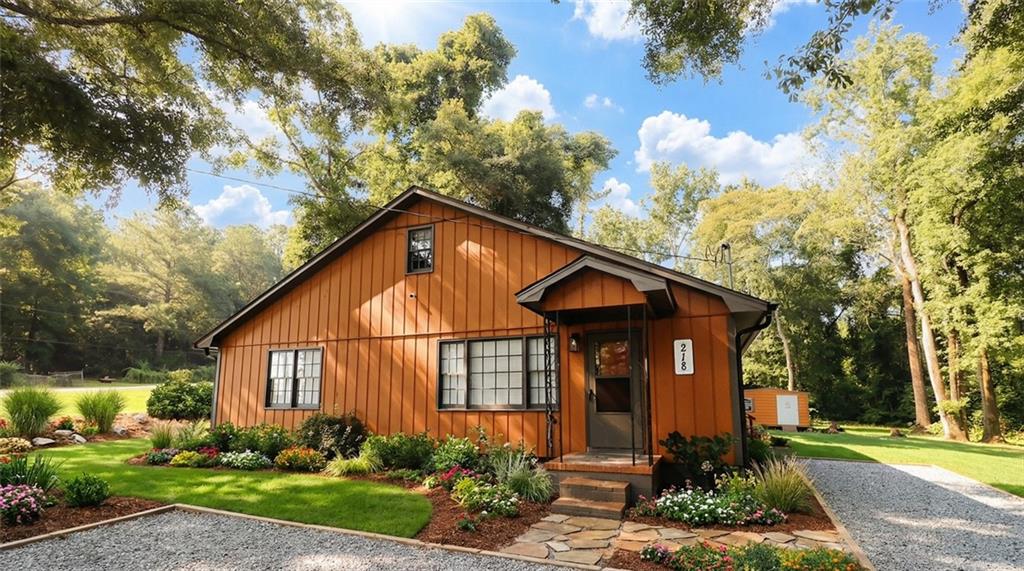 a front view of a house with garden