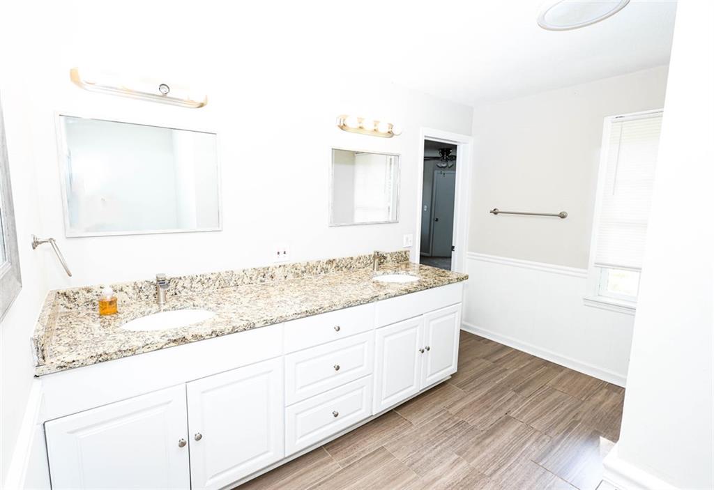 218 East Bonacre Road Cataula, GA 31804 - Photo 20 of 36 a bathroom with a granite countertop sink and a mirror